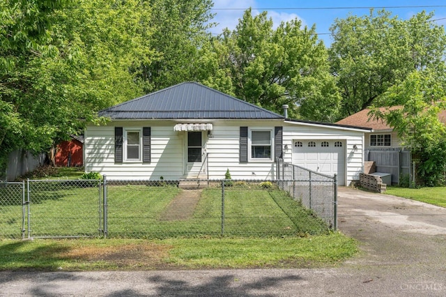 849 E Columbus St, Wilmington, OH 45177 - single story home featuring a garage, concrete driveway, metal roof, and a gate