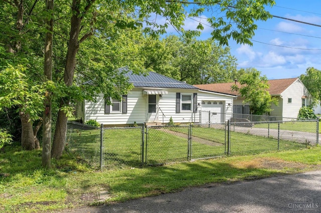 849 E Columbus St, Wilmington, OH 45177 - ranch-style home with a gate, driveway, a garage, and metal roof