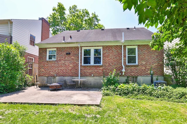 5038 W High St, Cincinnati, OH 45238 - rear view of house featuring a patio area, brick siding, a lawn, and a shingled roof