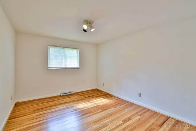 1885 Forest View Ct, Green Twp, OH 45233 - empty room with wood finished floors and baseboards