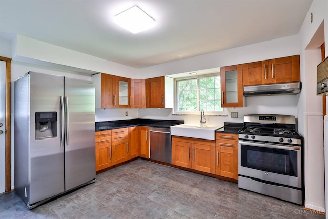 1885 Forest View Ct, Green Twp, OH 45233 - kitchen with stainless steel appliances, under cabinet range hood, a sink, and brown cabinets