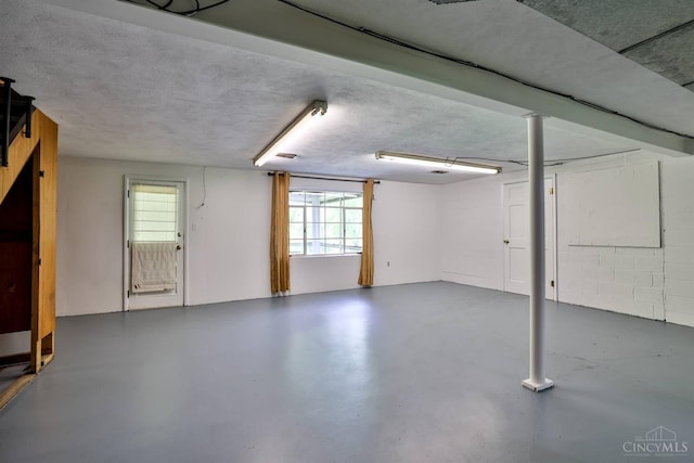 1885 Forest View Ct, Green Twp, OH 45233 - basement featuring healthy amount of natural light and a textured ceiling