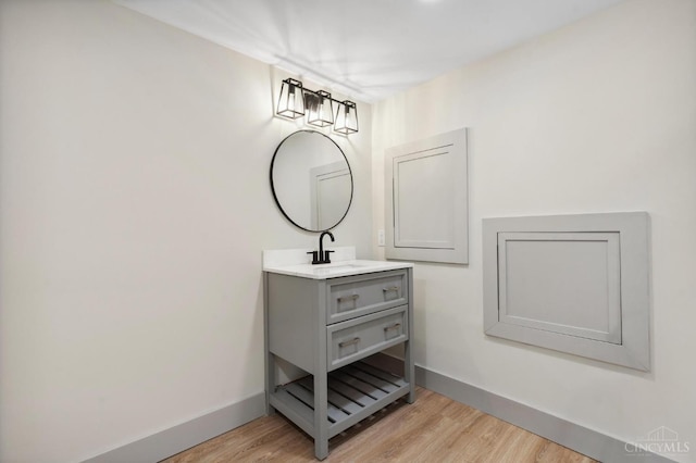 797 Fourth St, Reading, OH 45215 - bathroom featuring wood finished floors, vanity, and baseboards