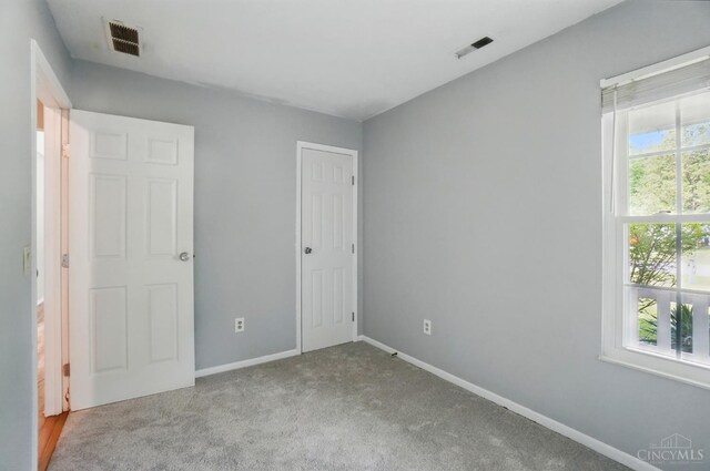 3914 Brookville Dr, Batavia Twp, OH 45102 - unfurnished bedroom featuring carpet floors, baseboards, and a closet
