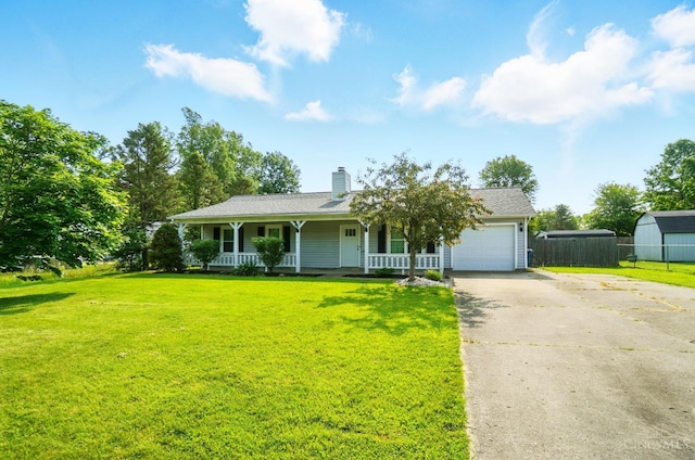 3914 Brookville Dr, Batavia Twp, OH 45102 - view of front of property with covered porch, a garage, concrete driveway, a chimney, and a shed