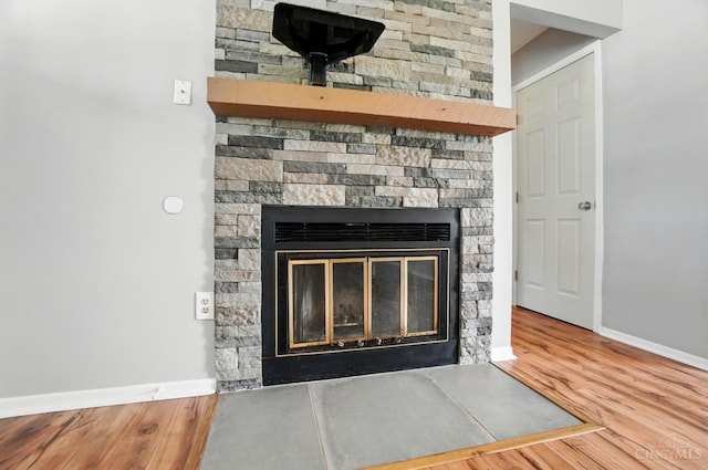 3914 Brookville Dr, Batavia Twp, OH 45102 - detailed view of a stone fireplace, baseboards, and wood finished floors