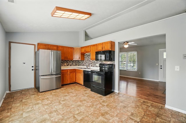 3914 Brookville Dr, Batavia Twp, OH 45102 - kitchen with black appliances, a sink, lofted ceiling, light countertops, and a ceiling fan