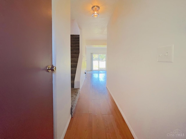 3610 Roosevelt Blvd Unit B, Middletown, OH 45044 - hallway featuring baseboards, light wood finished floors, and stairway