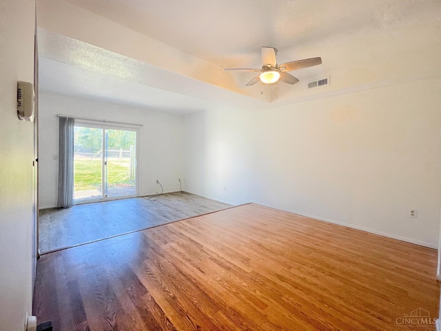 3610 Roosevelt Blvd Unit B, Middletown, OH 45044 - unfurnished room featuring wood finished floors, ceiling fan, a tray ceiling, and baseboards