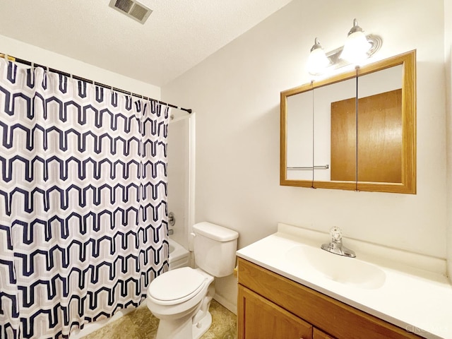 3610 Roosevelt Blvd Unit B, Middletown, OH 45044 - bathroom featuring vanity, shower / bath combo with shower curtain, toilet, and a textured ceiling