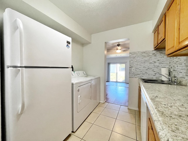 3610 Roosevelt Blvd Unit B, Middletown, OH 45044 - washroom featuring a sink, light tile patterned floors, ceiling fan, a textured ceiling, and independent washer and dryer