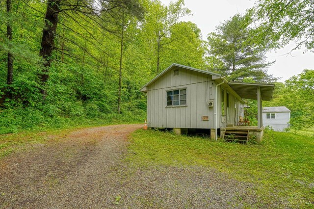 973 Umblebee Rd, Liberty Twp, OH 45613 - view of outbuilding featuring driveway and a view of trees