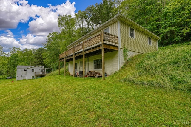 973 Umblebee Rd, Liberty Twp, OH 45613 - back of house featuring a deck and a lawn