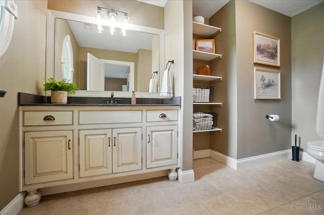7757 Misty Meadows Ct, Harlan Twp, OH 45152 - bathroom featuring vanity, toilet, baseboards, and tile patterned flooring