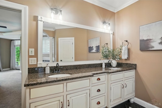 7757 Misty Meadows Ct, Harlan Twp, OH 45152 - bathroom with double vanity, ornamental molding, and baseboards