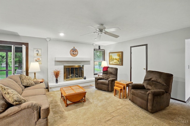 21 Garden Cir, Wilmington, OH 45177 - carpeted living area with a ceiling fan and a brick fireplace