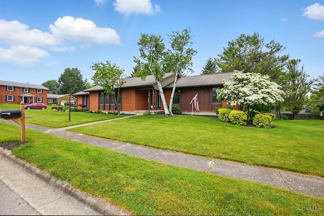 21 Garden Cir, Wilmington, OH 45177 - view of front of home with a front lawn and brick siding