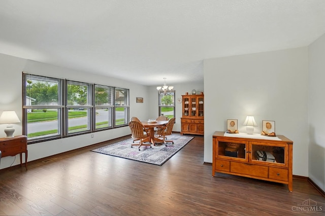 21 Garden Cir, Wilmington, OH 45177 - dining area with a chandelier, wood finished floors, and baseboards
