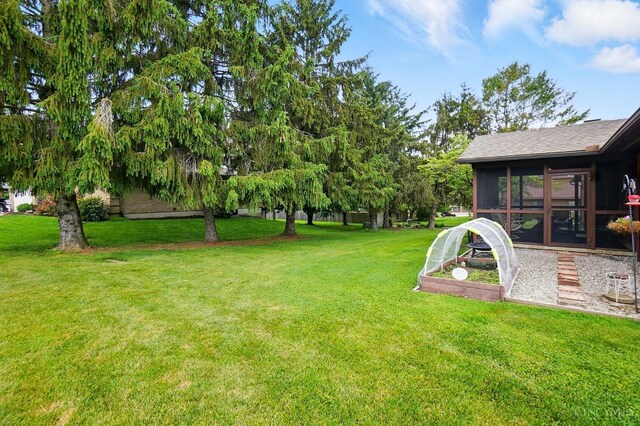 21 Garden Cir, Wilmington, OH 45177 - view of green lawn with a sunroom