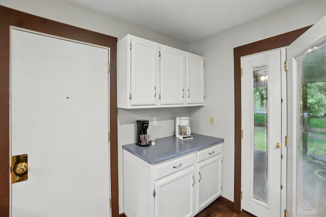 21 Garden Cir, Wilmington, OH 45177 - kitchen featuring white cabinetry, dark countertops, and dark wood-style flooring