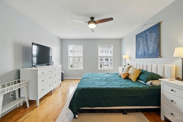 943 Steamboat Dr Unit 204, Union Twp, OH 45244 - bedroom with light wood-type flooring and ceiling fan