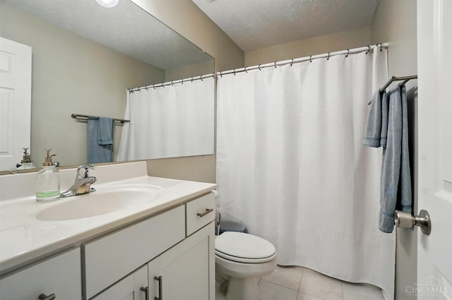 943 Steamboat Dr Unit 204, Union Twp, OH 45244 - bathroom with vanity, tile patterned flooring, toilet, a textured ceiling, and a shower with shower curtain