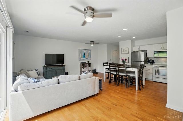 943 Steamboat Dr Unit 204, Union Twp, OH 45244 - living area with a ceiling fan, light wood-style floors, and recessed lighting