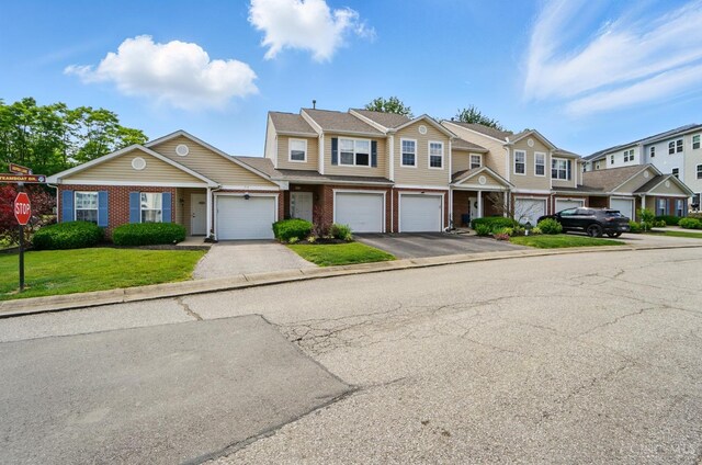 943 Steamboat Dr Unit 204, Union Twp, OH 45244 - multi unit property featuring driveway, brick siding, and a residential view