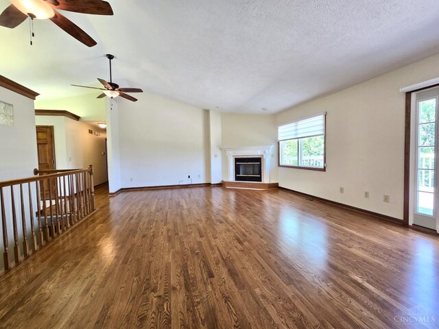 1244 Timber Creek Dr, Hanover Twp, OH 45013 - unfurnished living room with a ceiling fan, plenty of natural light, wood finished floors, vaulted ceiling, and a textured ceiling