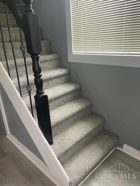 4 Cottage Ct, Anderson Twp, OH 45230 - staircase with baseboards and wood finished floors