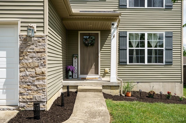 1240 Carriage Hill Ln, Hamilton, OH 45013 - property entrance with an attached garage