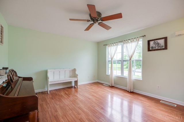 1240 Carriage Hill Ln, Hamilton, OH 45013 - spare room featuring a ceiling fan, light wood finished floors, and baseboards