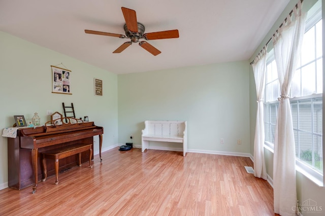 1240 Carriage Hill Ln, Hamilton, OH 45013 - empty room featuring light wood-style flooring, ceiling fan, and baseboards