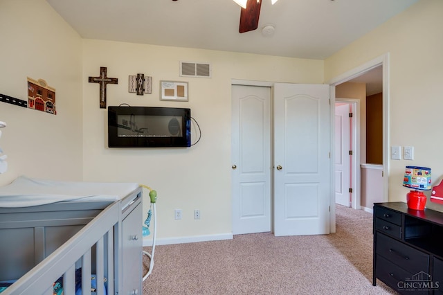 1240 Carriage Hill Ln, Hamilton, OH 45013 - bedroom with light colored carpet, a closet, baseboards, and a ceiling fan