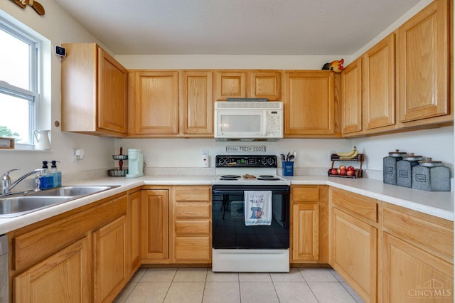 1240 Carriage Hill Ln, Hamilton, OH 45013 - kitchen with white appliances, a sink, light countertops, and light tile patterned floors