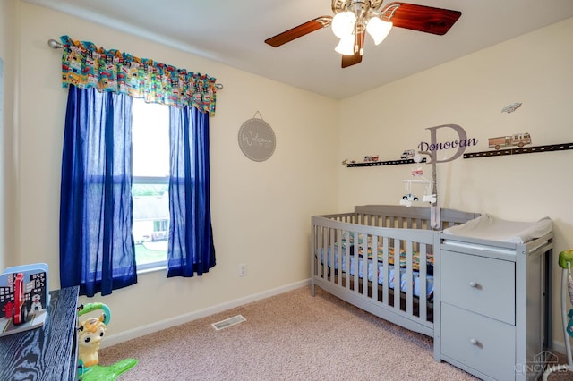 1240 Carriage Hill Ln, Hamilton, OH 45013 - carpeted bedroom with a nursery area, baseboards, and a ceiling fan