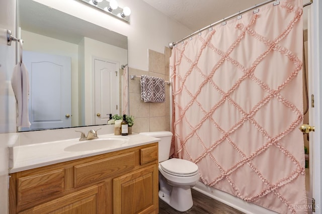 1240 Carriage Hill Ln, Hamilton, OH 45013 - full bathroom with vanity, toilet, tile walls, a shower with shower curtain, and wood finished floors