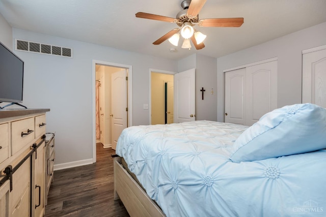 1240 Carriage Hill Ln, Hamilton, OH 45013 - bedroom with dark wood-style floors, baseboards, ceiling fan, and multiple closets