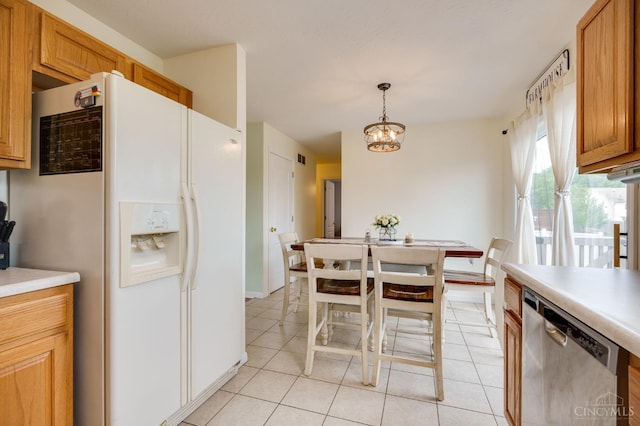 1240 Carriage Hill Ln, Hamilton, OH 45013 - kitchen with dishwasher, white refrigerator with ice dispenser, light tile patterned flooring, light countertops, and decorative light fixtures