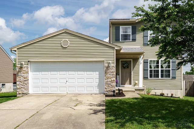 1240 Carriage Hill Ln, Hamilton, OH 45013 - traditional home featuring driveway, an attached garage, a front yard, and stone siding