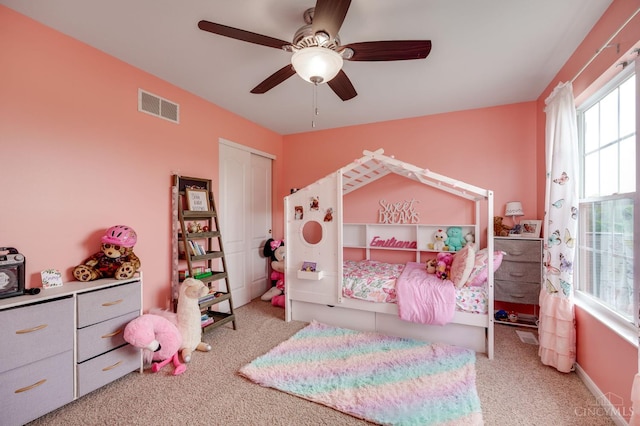 1240 Carriage Hill Ln, Hamilton, OH 45013 - carpeted bedroom featuring multiple windows, a closet, and ceiling fan