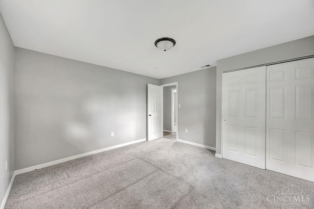 8486 US Route 127, West Manchester, OH 45382 - unfurnished bedroom with carpet floors, baseboards, and a closet