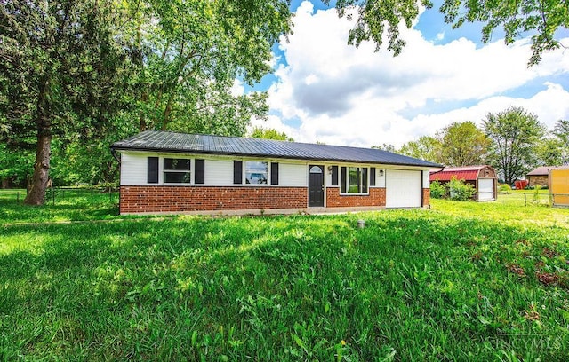 8486 US Route 127, West Manchester, OH 45382 - ranch-style home featuring brick siding, an attached garage, and metal roof