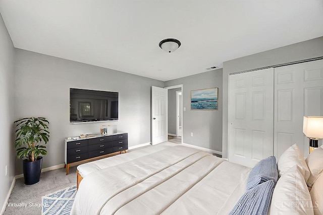 8486 US Route 127, West Manchester, OH 45382 - bedroom featuring baseboards, a closet, and light carpet