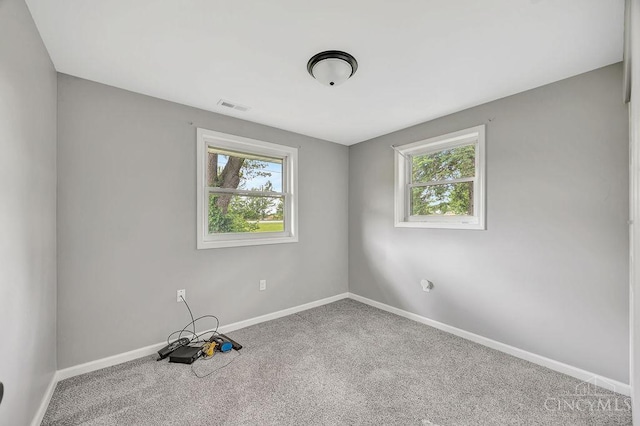8486 US Route 127, West Manchester, OH 45382 - unfurnished room with plenty of natural light, carpet floors, and baseboards