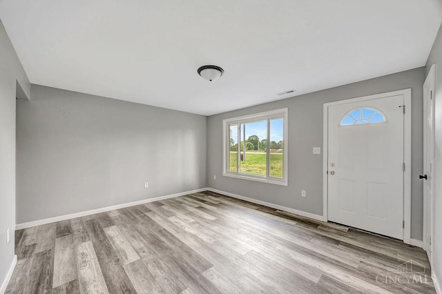 8486 US Route 127, West Manchester, OH 45382 - foyer entrance featuring healthy amount of natural light, wood finished floors, and baseboards