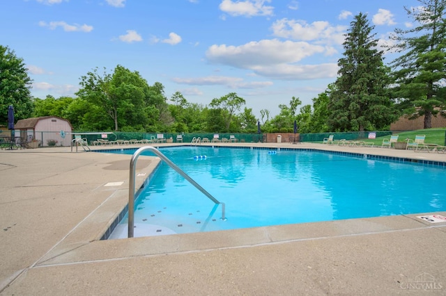 6604 Hearne Rd Unit 58, Green Twp, OH 45248 - community pool with a patio area and view of scattered trees