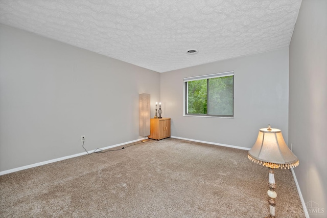 6604 Hearne Rd Unit 58, Green Twp, OH 45248 - empty room featuring carpet flooring, baseboards, and a textured ceiling