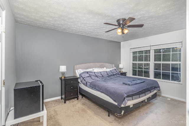 7638 Lake Pointe, Hamilton Twp, OH 45039 - carpeted bedroom with baseboards, a textured ceiling, and a ceiling fan