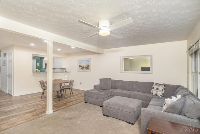 7638 Lake Pointe, Hamilton Twp, OH 45039 - living area with a ceiling fan, wood finished floors, recessed lighting, a textured ceiling, and baseboards